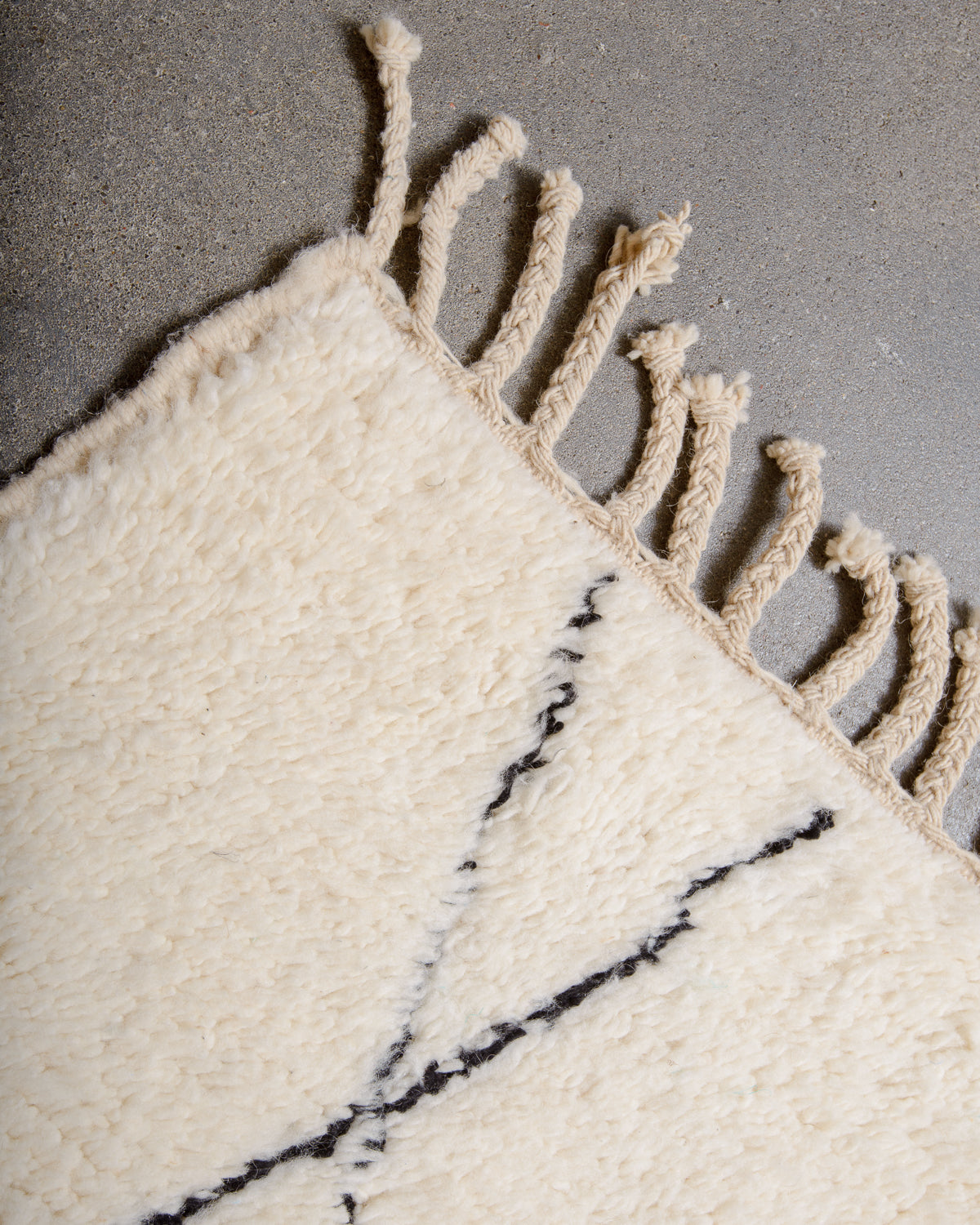 Modern, designer, handcrafted Berber rug from Morocco. Beniourain carpet with minimalist design, natural wool pile and a fluffy texture.